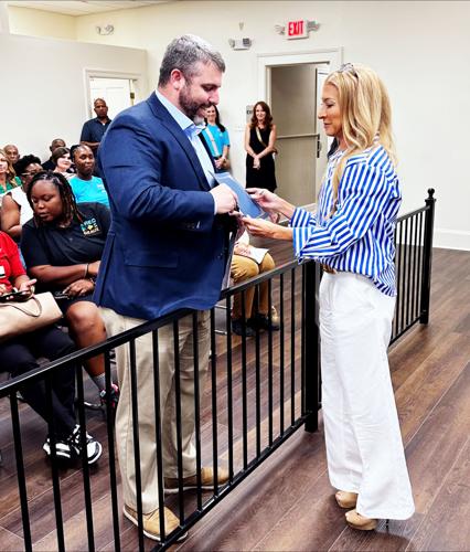 zac Noel accepts certificate from DeVirgilio.jpg